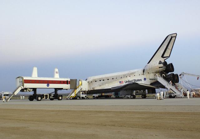 NASA's Crew Transport Vehicle, or CTV, pulls up to the Space Shuttle Discovery to offload the crew after a successful landing August 9, 2005