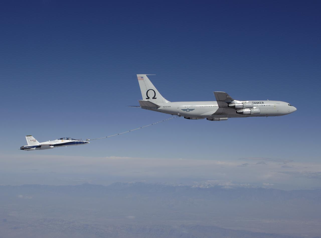 F/A-18 #845 behind an Omega Air Boeing 707 tanker during an Autonomous Airborne Refueling Demonstration (AARD) flight.