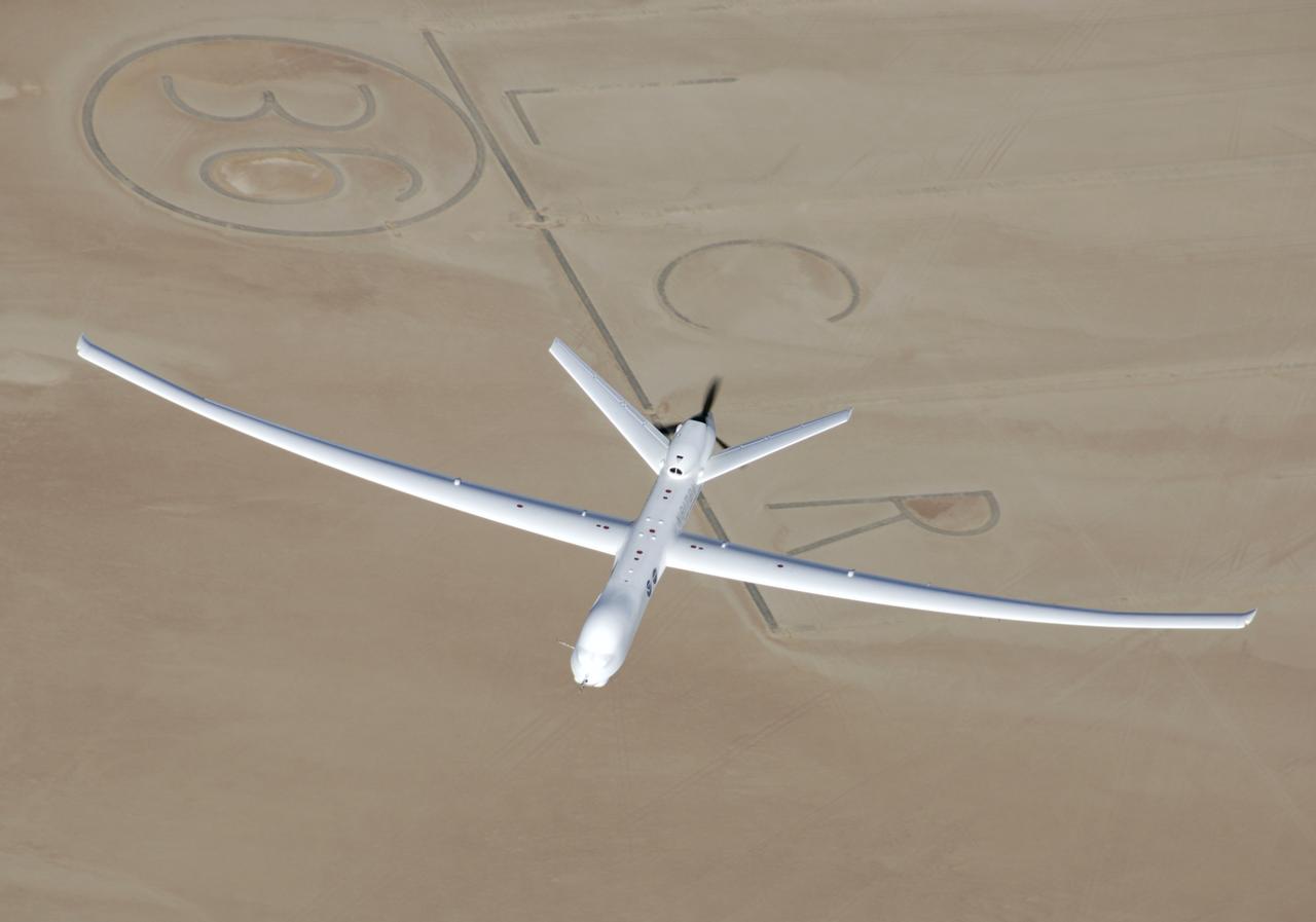 General Atomics' remotely-operated Altair soars over Rogers Dry Lake at Edwards Air Force Base during a NOAA/NASA earth science mission in November 2005.