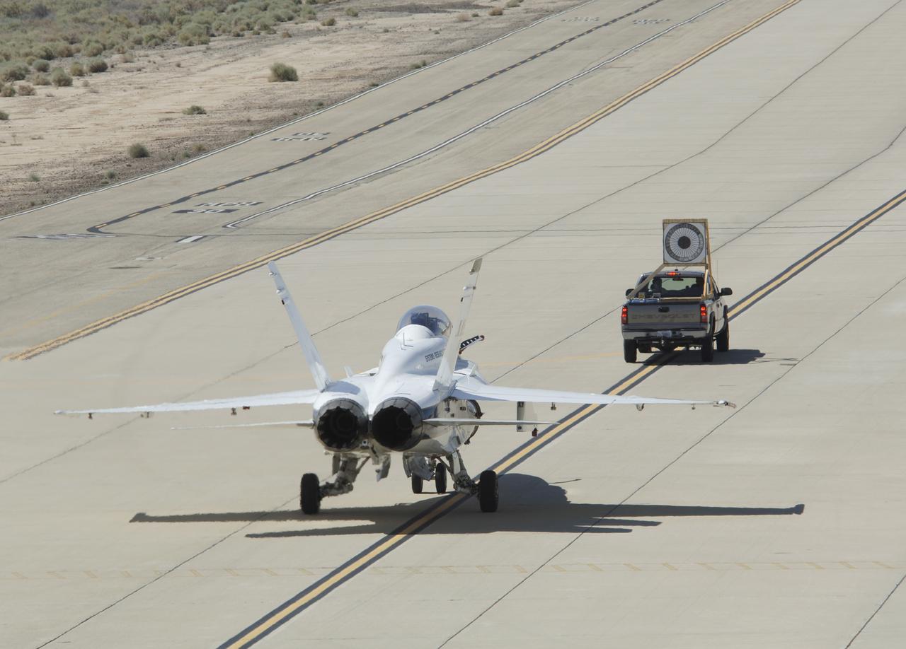 F/A-18 #845 testing autonomous system for AARD project by following a pickup with an airborne tanker drogue illustration.