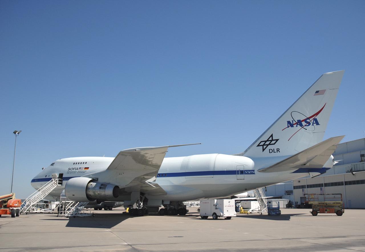 NASA's freshly painted Stratospheric Observatory for Infrared Astronomy (SOFIA) 747SP is shown at L-3 Communications Integrated Systems' facility in Waco, Texas, where major modifications and installation was performed. The observatory, which features a German-built 100-inch (2.5 meter) diameter infrared telescope weighing 20 tons, is approaching the flight test phase as part of a joint program by NASA and DLR Deutsches Zentrum fuer Luft- und Raumfahrt (German Aerospace Center). SOFIA's science and mission operations are being planned jointly by Universities Space Research Association (USRA) and the Deutsches SOFIA Institut (DSI). Once operational, SOFIA will be the world's primary infrared observatory during a mission lasting up to 20 years, as well as an outstanding laboratory for developing and testing instrumentation and detector technology.