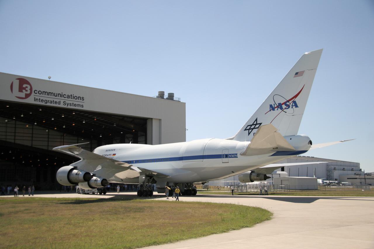 NASA's freshly painted Stratospheric Observatory for Infrared Astronomy (SOFIA) 747SP aircraft sits outside a hangar at L-3 Communications Integrated Systems' facility in Waco, Texas. The observatory, which features a German-built 100-inch (2.5 meter) diameter infrared telescope weighing 20 tons, is approaching the flight test phase as part of a joint program by NASA and DLR Deutsches Zentrum fuer Luft- und Raumfahrt (German Aerospace Center). SOFIA's science and mission operations are being planned jointly by Universities Space Research Association (USRA) and the Deutsches SOFIA Institut (DSI). Once operational, SOFIA will be the world's primary infrared observatory during a mission lasting up to 20 years, as well as an outstanding laboratory for developing and testing instrumentation and detector technology.