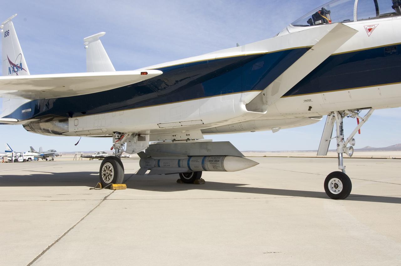 An inert AIM-54 Phoenix missile nestled under the fuselage of NASA Dryden's F-15B aircraft is being studied as a possible test vehicle to obtain hypersonic data.