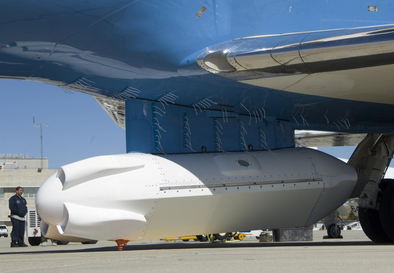 A forest of tufts are mounted on the underbelly and pylon of NASA's Gulfstream-III research aircraft to help engineers determine airflow around the UAVSAR pod.