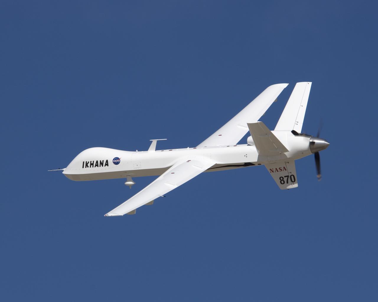 Its white surfaces in contrast with the deep blue sky, NASA's Ikhana unmanned science and technology development aircraft soars over California's high desert.