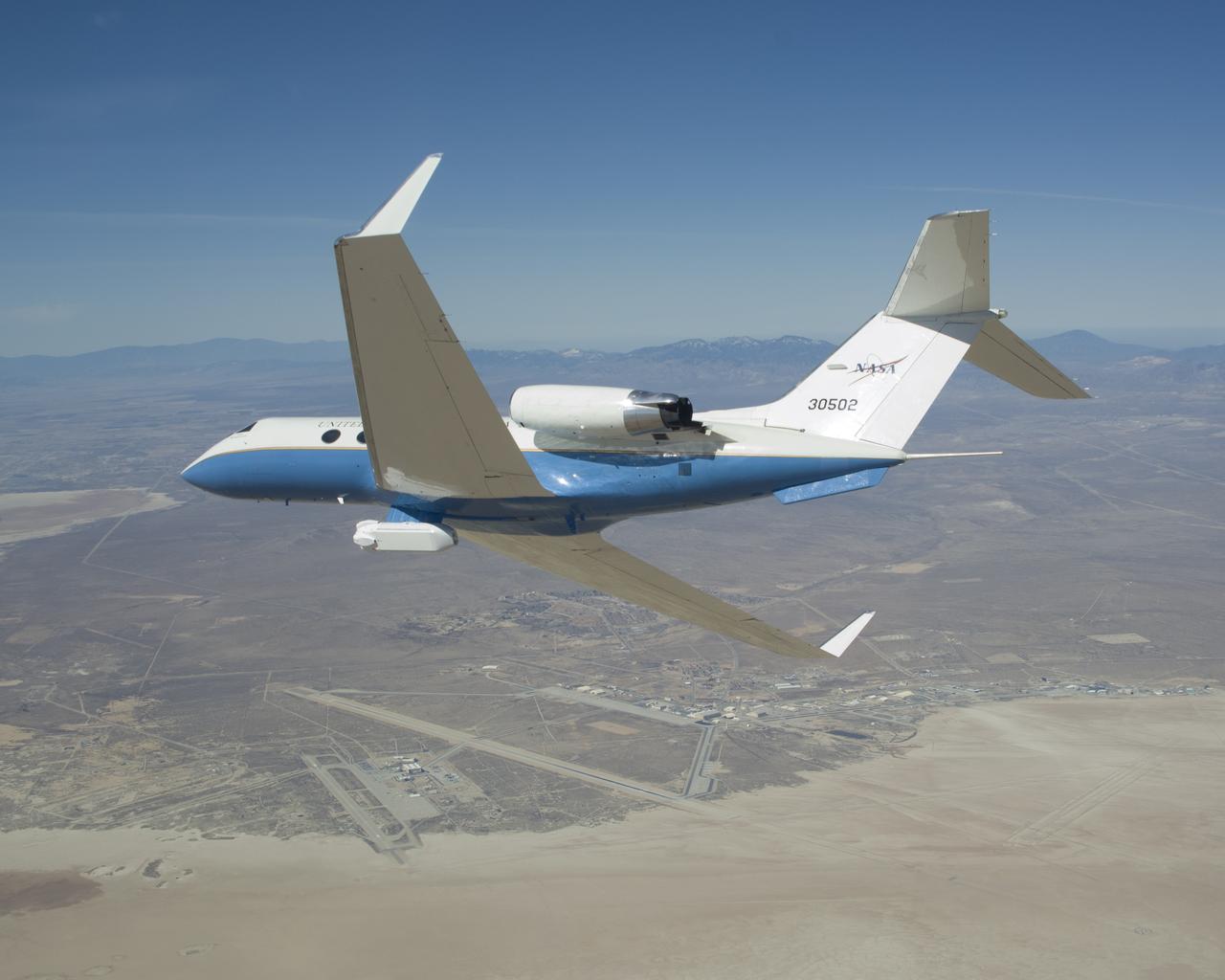 The UAVSAR underbelly pod is in clear view as NASA's Gulfstream-III research aircraft banks away over Edwards AFB during aerodynamic clearance flights.