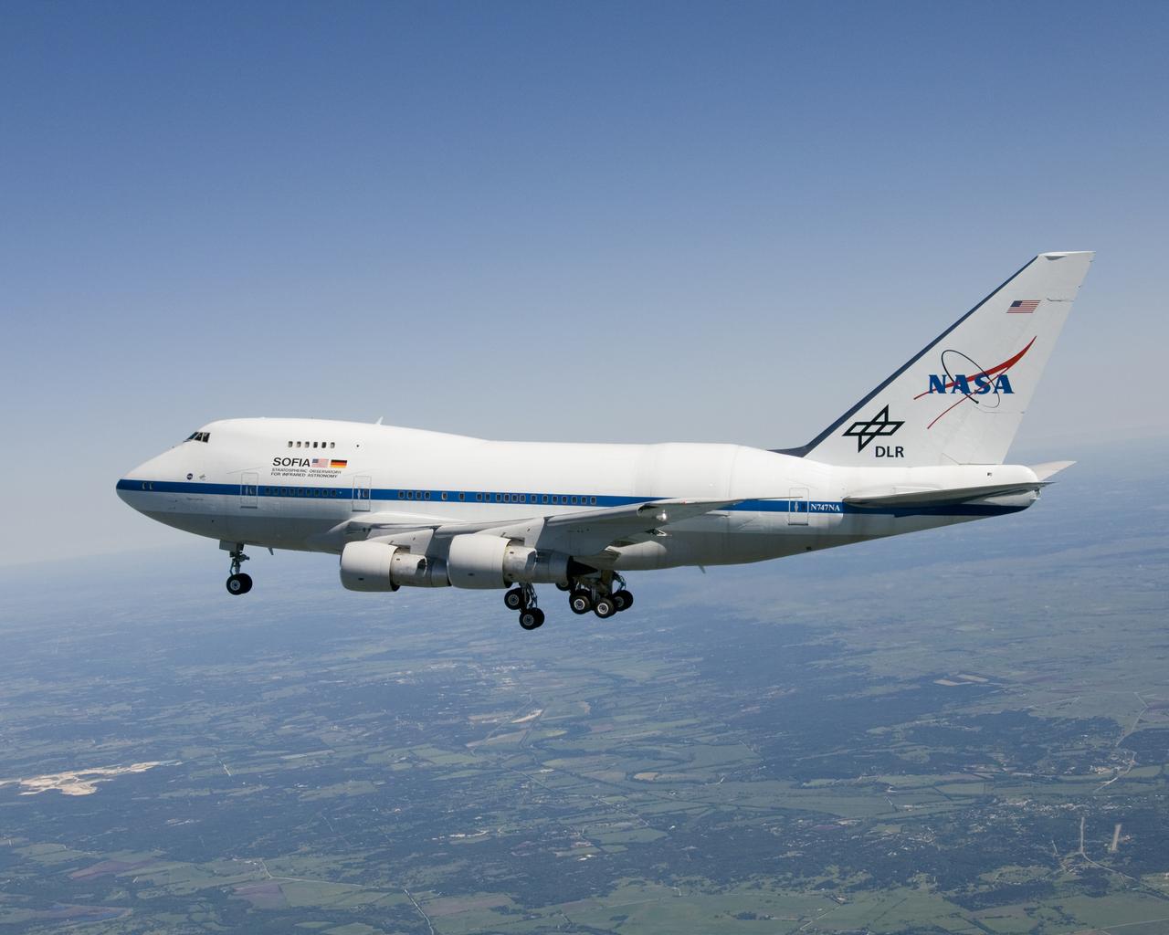 Christened "Clipper Lindbergh" when it flew for Pan American Airways in the 1970s, the SOFIA 747SP shows evidence of modification to its aft fuselage contours to accommodate a 16-foot-tall opening for a 45,000-pound infrared telescope. This inflight photo was taken on SOFIA's first flight since its modification to become an airborne observatory.