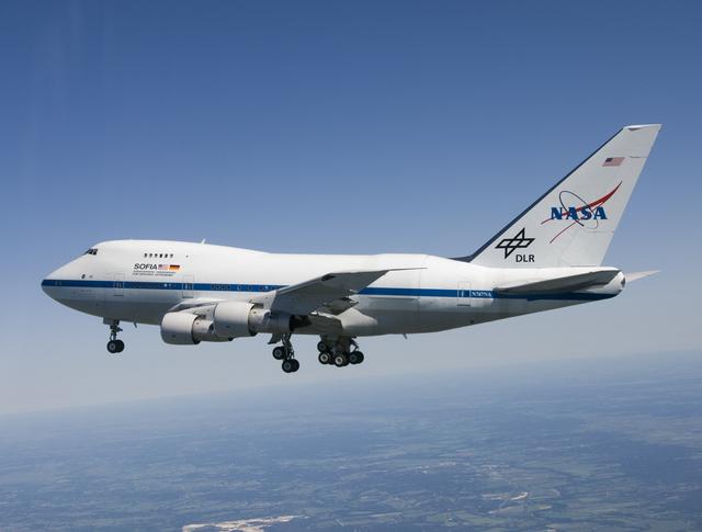 NASA image: With landing gear extended, the NASA/DLR Stratospheric Observatory for Infared Astronomy (SOFIA) 747SP cruises over central Texas on its first checkout flight