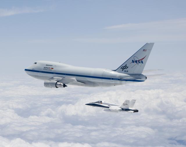 NASA image: NASA's SOFIA airborne observatory is shadowed by a NASA F/A-18 safety chase aircraft during its second checkout flight near Waco, Texas on May 10, 2007