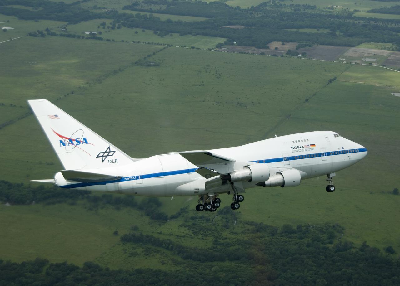 NASA's highly modified Boeing 747SP SOFIA observatory banks low over the Texas countryside as it heads for landing at Waco to conclude its second check flight.