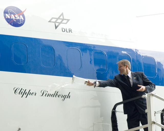 NASA image: Erik Lindbergh christens NASA's 747 Clipper Lindbergh with a special commemorative concoction representing local, NASA, and industry partners