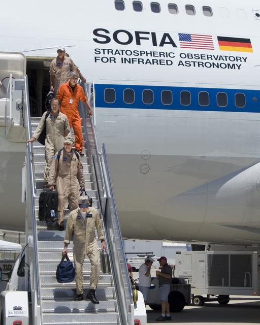 NASA image: The SOFIA flight crew descends the stairs after ferrying the 747SP airborne observatory from Waco, TX, to NASA's Dryden Flight Research Center in California