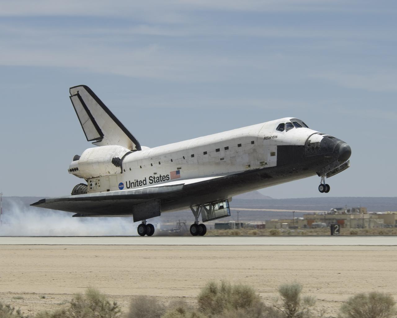 The Space Shuttle Atlantis touches down at Edwards AFB on June 22, 2007, to conclude International Space Station construction and supply mission STS-117.