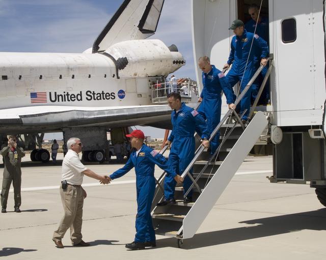 NASA image: DFRC Center Director Kevin Petersen greets Commander Frederick Sturckow and the crew of the Space Shuttle Atlantis at Edwards, AFB, Calif., on June 22, 2007