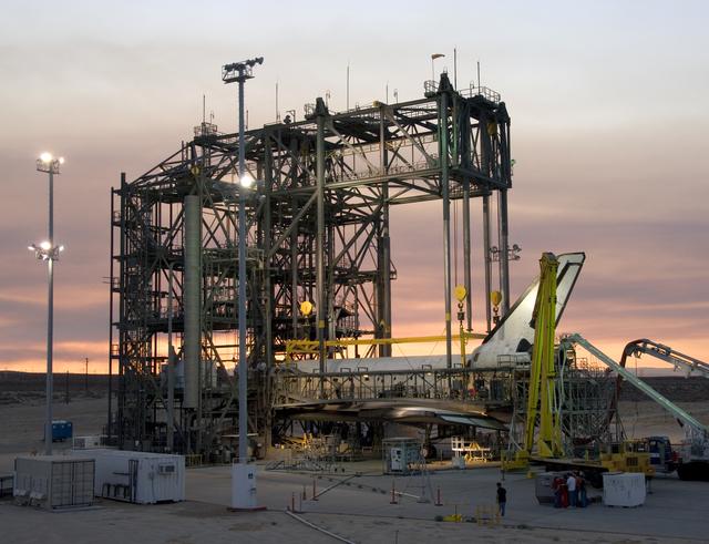 NASA image: The Space Shuttle Atlantis receives post-flight servicing in the Mate-Demate Device (MDD) at NASA's Dryden Flight Research Center, Edwards, Calif.