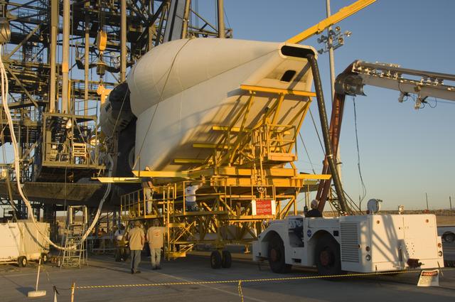 NASA image: Technicians attach the tail cone to the Space Shuttle Atlantis in preparation for its return to NASA's Kennedy Space Center in Florida