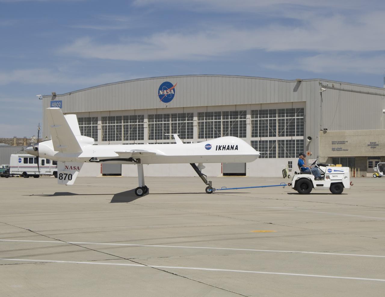 After arriving via a ferry flight on June 23, 2007, NASA's Ikhana unmanned science demonstration aircraft is towed to a hangar at its new home, the Dryden Flight Research Center in Southern California.