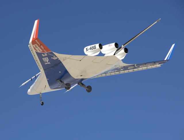 NASA image: The unique manta-ray shaped planform of the Blended Wing Body X-48B is evidenced as the subscale demonstrator soars over Edwards AFB on its first test flight