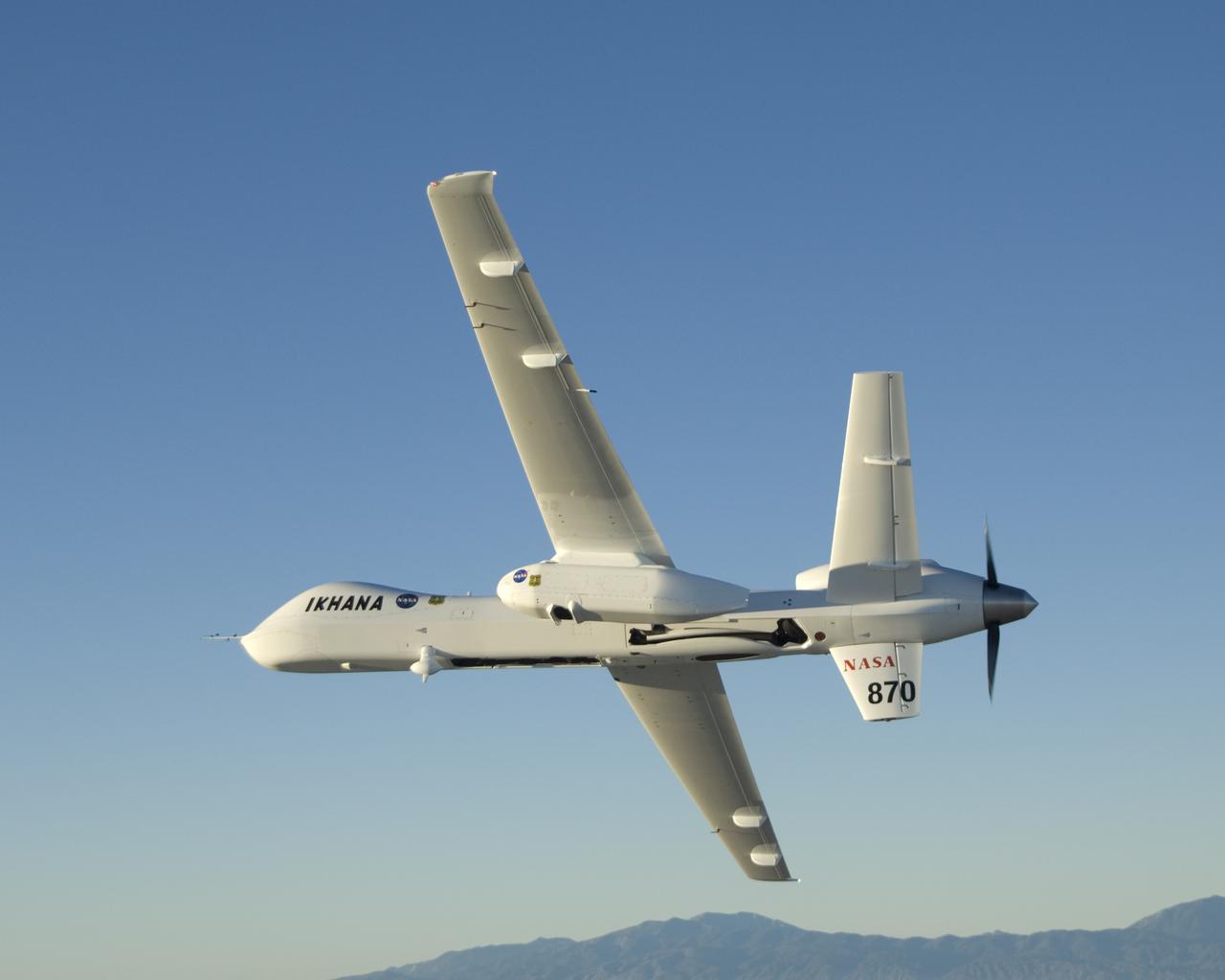 Carrying its sensor pod, NASA's remotely piloted Ikhana unmanned aircraft banks away during a checkout flight in the Western States Fire Mission.