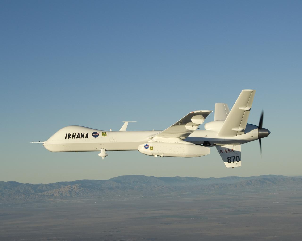 With its sensor pod under its left wing, NASA's remotely piloted Ikhana unmanned aircraft cruises over California during the Western States Fire Mission.