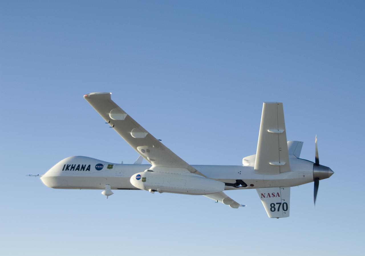 With its thermal-infared sensor pod under its left wing, NASA's Ikhana unmanned aircraft cruises over California during the Western States Fire Mission.