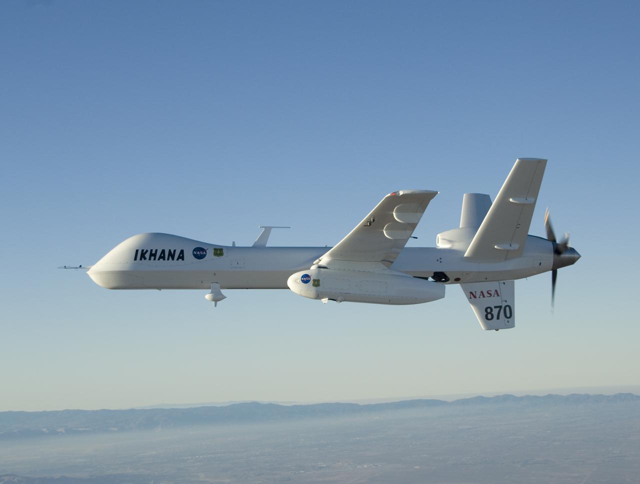 NASA's Ikhana remotely piloted aircraft soars over smoky terrain during a wildfire imaging demonstration mission in the late summer of 2007.