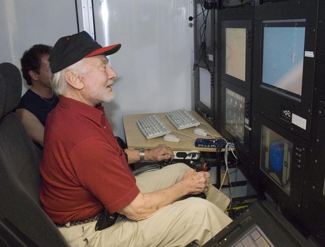 NASA image: Apollo 11 astronaut Buzz Aldrin tries out the control station for the X-48B Blended Wing Body unmanned subscale demonstrator during a tour of NASA Dryden