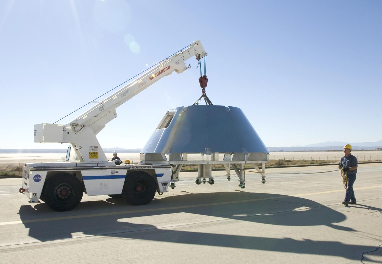 Rogers Dry Lake serves as a backdrop for a mockup Orion crew module built by NASA Dryden Flight Research Center's Fabrication Branch. The module was relocated to Dryden's Shuttle hangar on Sept. 25, 2007.