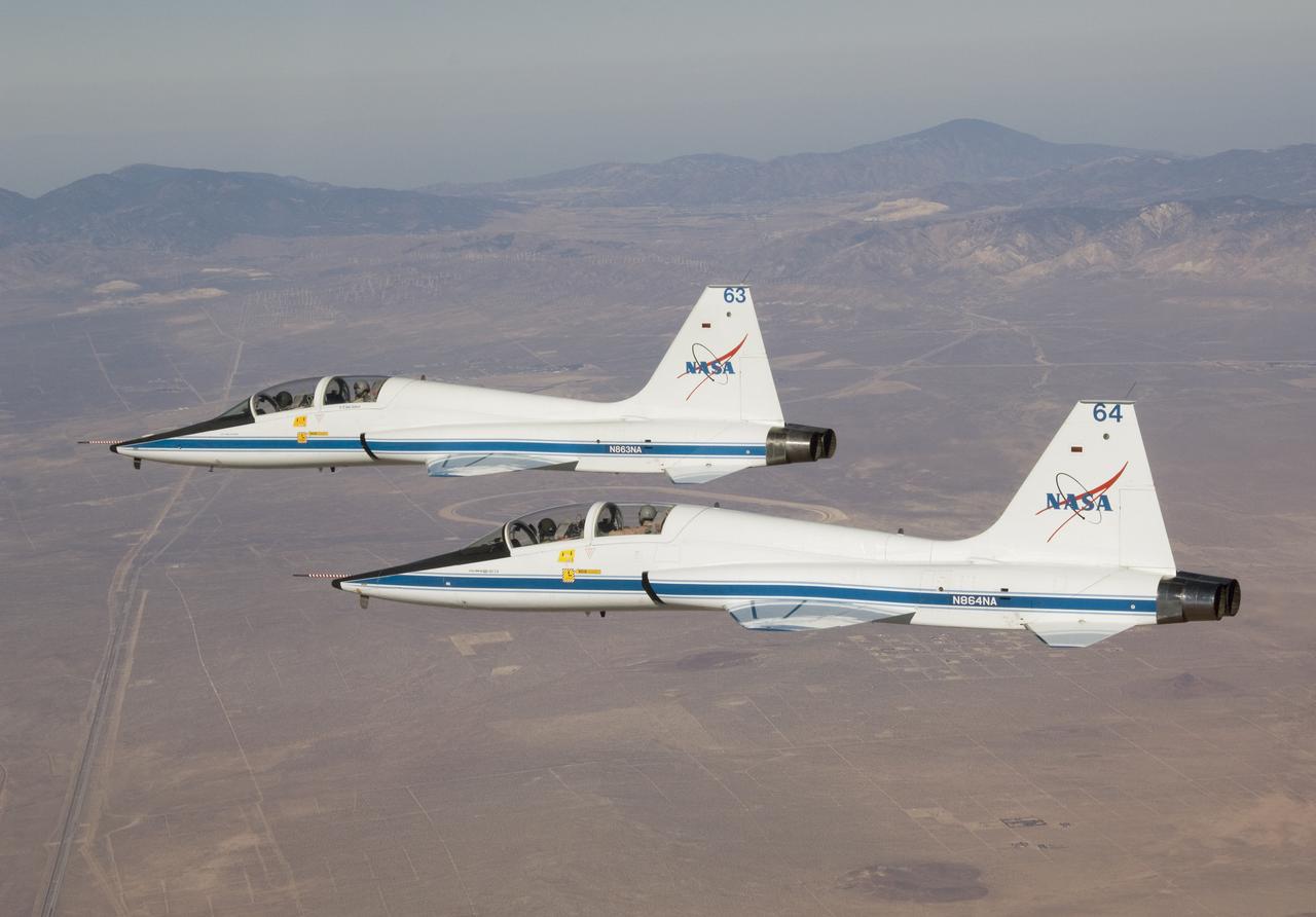 NASA Dryden Flight Research Center's two T-38A Talon mission support aircraft flew together for the first time on Sept. 26, 2007 while conducting pitot-static airspeed calibration checks during routine pilot proficiency flights. The two aircraft, flown by NASA research pilots Kelly Latimer and Frank Batteas, joined up with a NASA Dryden F/A-18 flown by NASA research pilot Dick Ewers to fly the airspeed calibrations at several speeds and altitudes that would be flown by the Stratospheric Observatory for Infrared Astronomy (SOFIA) Boeing 747SP during its initial flight test phase. The T-38s, along with F/A-18s, serve in a safety chase role during those test missions, providing critical instrument and visual monitoring for the flight test series.