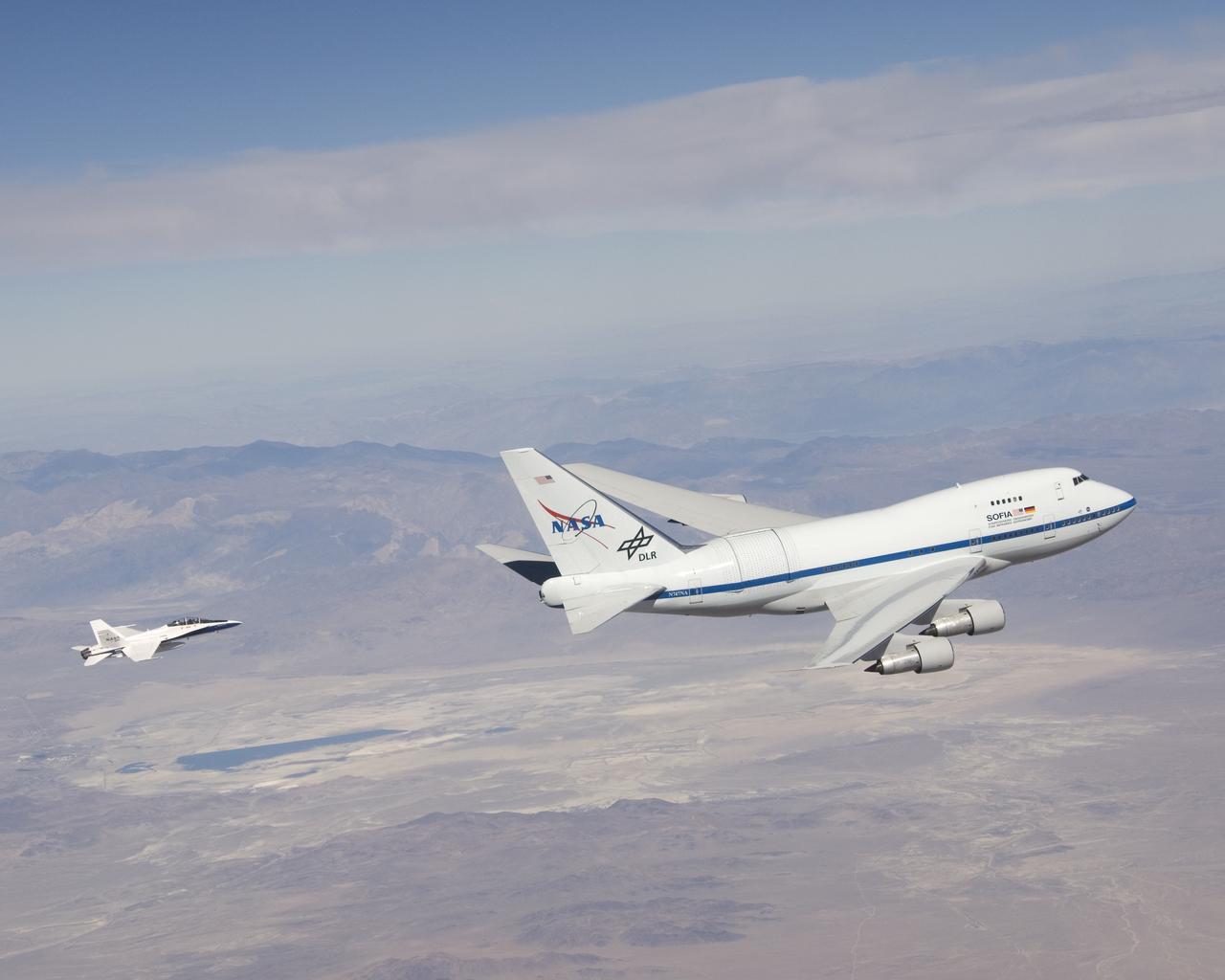 NASA's Stratospheric Observatory for Infrared Astronomy, or SOFIA, arrived at NASA's Dryden Flight Research Center at Edwards Air Force Base, Calif. on May 31, 2007. The heavily modified Boeing 747SP was ferried to Dryden from Waco, Texas, where L-3 Communications Integrated Systems installed a German-built 2.5-meter infrared telescope and made other major modifications over the past several years. SOFIA is scheduled to undergo installation and integration of mission systems and a multi-phase flight test program at Dryden over the next three years that is expected to lead to a full operational capability to conduct astronomy missions in about 2010. During its expected 20-year lifetime, SOFIA will be capable of "Great Observatory" class astronomical science, providing astronomers with access to the visible, infrared and sub-millimeter spectrum with optimized performance in the mid-infrared to sub-millimeter range.