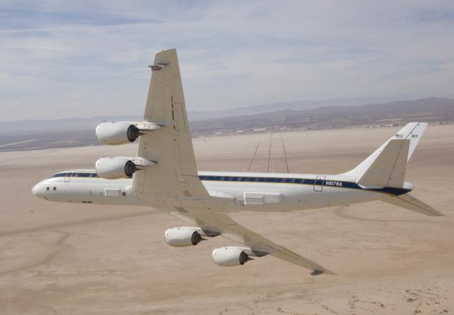 NASA image: NASA's DC-8 airborne science laboratory banks low over Rogers Dry Lake at Edwards Air Force upon its return to NASA Dryden Flight Research Center Nov. 8, 2007