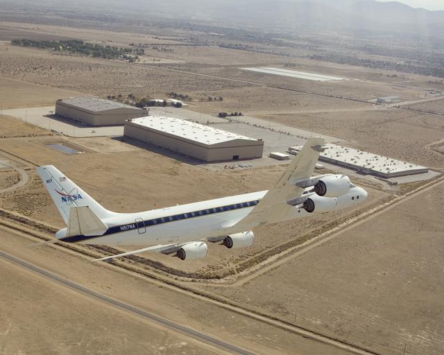 NASA image: NASA's DC-8 airborne science laboratory banks low over the Dryden Aircraft Operations Facility at Air Force Plant 42 in Palmdale, Calif., upon arrival November 8