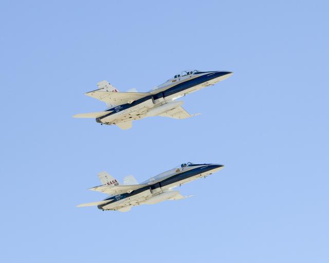 NASA image: Two NASA Dryden F/A-18s flown by Gordon Fullerton and Nils Larson fly in tight formation Dec. 21, 2007 during Fullerton's final flight before his retirement.