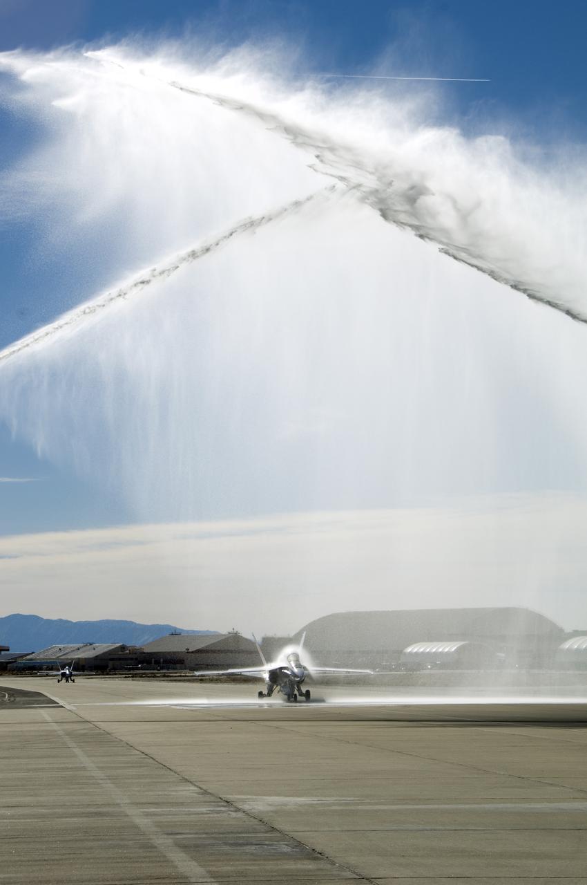 Long-time NASA Dryden research pilot and former astronaut C. Gordon Fullerton capped an almost 50-year flying career, including more than 38 years with NASA, with a final flight in a NASA F/A-18 on Dec. 21, 2007. Fullerton and Dryden research pilot Jim Smolka flew a 90-minute pilot proficiency formation aerobatics flight with another Dryden F/A-18 and a Dryden T-38 before concluding with two low-level formation flyovers of Dryden before landing. Fullerton was honored with a water-cannon spray arch provided by two fire trucks from the Edwards Air Force Base fire department as he taxied the F/A-18 up to the Dryden ramp, and was then greeted by his wife Marie and several hundred Dryden staff after his final flight.  Fullerton began his flying career with the U.S. Air Force in 1958 after earning bachelor's and master's degrees in mechanical engineering from the California Institute of Technology. Initially trained as a fighter pilot, he later transitioned to multi-engine bombers and became a bomber operations test pilot after attending the Air Force Aerospace Research Pilot School at Edwards Air Force Base, Calif. He then was assigned to the flight crew for the planned Air Force Manned Orbital Laboratory in 1966.  Upon cancellation of that program, the Air Force assigned Fullerton to NASA's astronaut corps in 1969. He served on the support crews for the Apollo 14, 15, 16 and 17 lunar missions, and was later assigned to one of the two flight crews that piloted the space shuttle prototype Enterprise during the Approach and Landing Test program at Dryden. He then logged some 382 hours in space when he flew on two early space shuttle missions, STS-3 on Columbia in 1982 and STS-51F on Challenger in 1985. He joined the flight crew branch at NASA Dryden after leaving the astronaut corps in 1986.  During his 21 years at Dryden, Fullerton was project pilot on a number of high-profile research efforts, including the Propulsion Controlled Aircraft, the high-speed landing tests of 