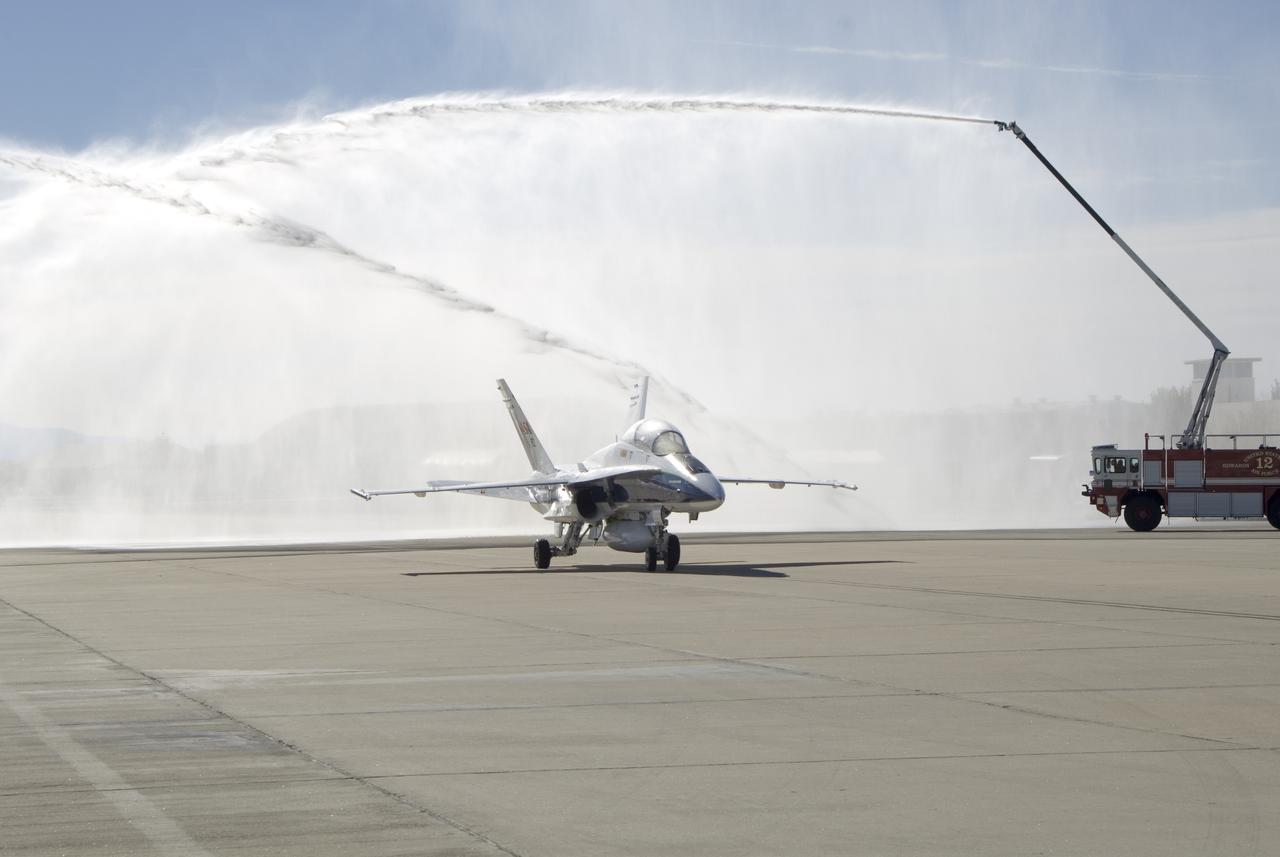 Long-time NASA Dryden research pilot and former astronaut C. Gordon Fullerton capped an almost 50-year flying career, including more than 38 years with NASA, with a final flight in a NASA F/A-18 on Dec. 21, 2007. Fullerton and Dryden research pilot Jim Smolka flew a 90-minute pilot proficiency formation aerobatics flight with another Dryden F/A-18 and a Dryden T-38 before concluding with two low-level formation flyovers of Dryden before landing. Fullerton was honored with a water-cannon spray arch provided by two fire trucks from the Edwards Air Force Base fire department as he taxied the F/A-18 up to the Dryden ramp, and was then greeted by his wife Marie and several hundred Dryden staff after his final flight.  Fullerton began his flying career with the U.S. Air Force in 1958 after earning bachelor's and master's degrees in mechanical engineering from the California Institute of Technology. Initially trained as a fighter pilot, he later transitioned to multi-engine bombers and became a bomber operations test pilot after attending the Air Force Aerospace Research Pilot School at Edwards Air Force Base, Calif. He then was assigned to the flight crew for the planned Air Force Manned Orbital Laboratory in 1966.  Upon cancellation of that program, the Air Force assigned Fullerton to NASA's astronaut corps in 1969. He served on the support crews for the Apollo 14, 15, 16 and 17 lunar missions, and was later assigned to one of the two flight crews that piloted the space shuttle prototype Enterprise during the Approach and Landing Test program at Dryden. He then logged some 382 hours in space when he flew on two early space shuttle missions, STS-3 on Columbia in 1982 and STS-51F on Challenger in 1985. He joined the flight crew branch at NASA Dryden after leaving the astronaut corps in 1986.  During his 21 years at Dryden, Fullerton was project pilot on a number of high-profile research efforts, including the Propulsion Controlled Aircraft, the high-speed landing tests of 