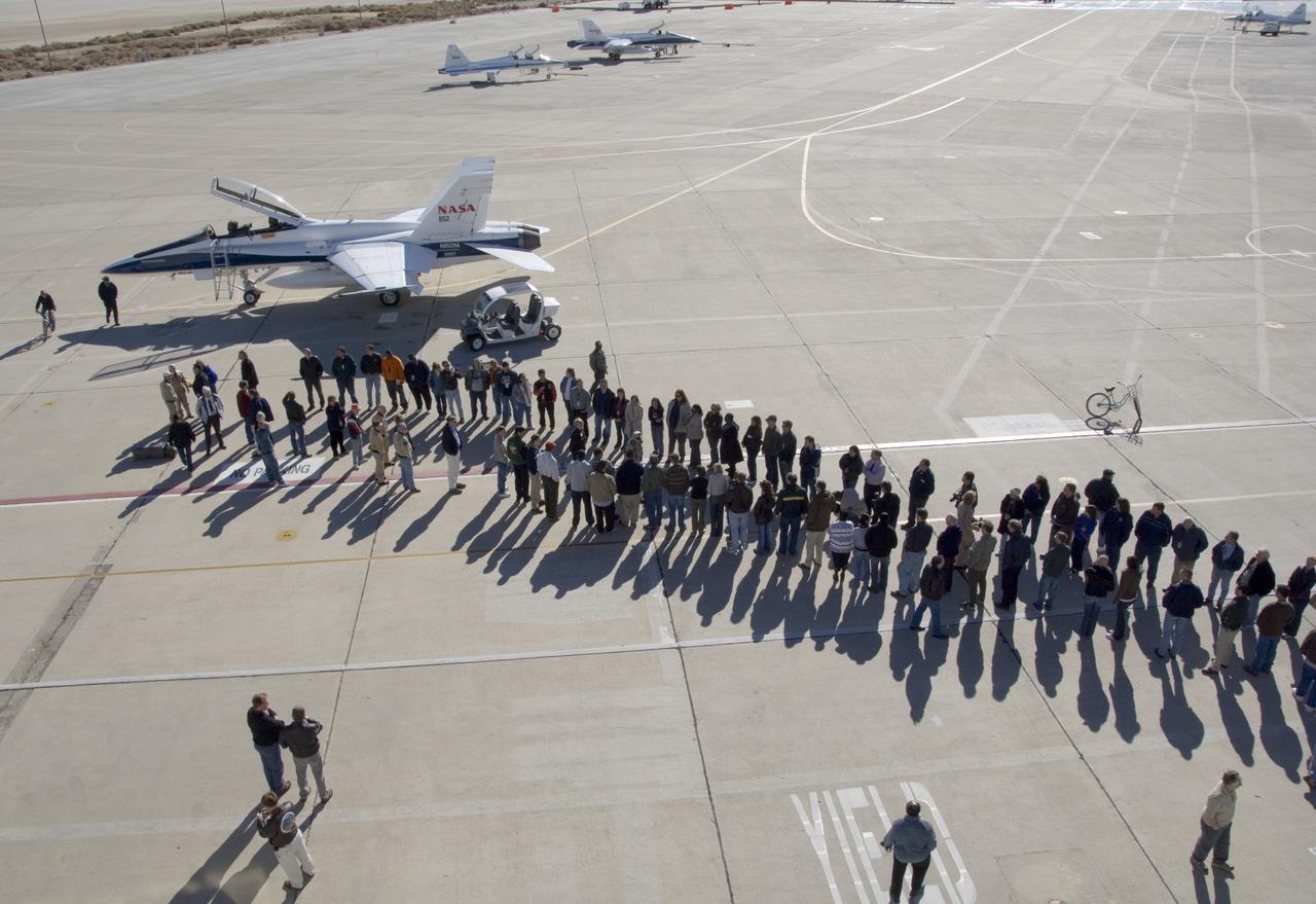 Long-time NASA Dryden research pilot and former astronaut C. Gordon Fullerton capped an almost 50-year flying career, including more than 38 years with NASA, with a final flight in a NASA F/A-18 on Dec. 21, 2007. Fullerton and Dryden research pilot Jim Smolka flew a 90-minute pilot proficiency formation aerobatics flight with another Dryden F/A-18 and a Dryden T-38 before concluding with two low-level formation flyovers of Dryden before landing. Fullerton was honored with a water-cannon spray arch provided by two fire trucks from the Edwards Air Force Base fire department as he taxied the F/A-18 up to the Dryden ramp, and was then greeted by his wife Marie and several hundred Dryden staff after his final flight.  Fullerton began his flying career with the U.S. Air Force in 1958 after earning bachelor's and master's degrees in mechanical engineering from the California Institute of Technology. Initially trained as a fighter pilot, he later transitioned to multi-engine bombers and became a bomber operations test pilot after attending the Air Force Aerospace Research Pilot School at Edwards Air Force Base, Calif. He then was assigned to the flight crew for the planned Air Force Manned Orbital Laboratory in 1966. Upon cancellation of that program, the Air Force assigned Fullerton to NASA's astronaut corps in 1969.  He served on the support crews for the Apollo 14, 15, 16 and 17 lunar missions, and was later assigned to one of the two flight crews that piloted the space shuttle prototype Enterprise during the Approach and Landing Test program at Dryden. He then logged some 382 hours in space when he flew on two early space shuttle missions, STS-3 on Columbia in 1982 and STS-51F on Challenger in 1985. He joined the flight crew branch at NASA Dryden after leaving the astronaut corps in 1986.  During his 21 years at Dryden, Fullerton was project pilot on a number of high-profile research efforts, including the Propulsion Controlled Aircraft, the high-speed landing tests of 