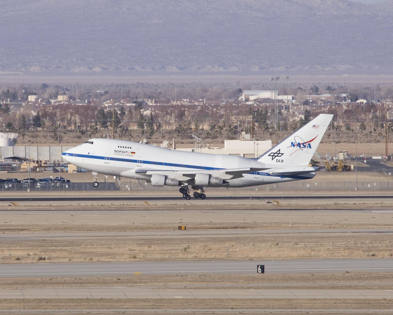 NASA's SOFIA infrared observatory touches down at Air Force Plant 42 in Palmdale, Calif., as it arrives at its new home, the Dryden Aircraft Operations Facility.