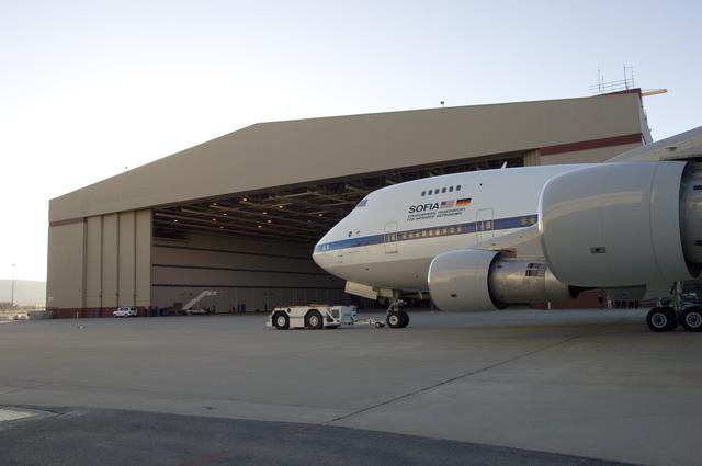NASA image: An aircraft tug tows NASA's SOFIA infrared observatory 747SP into Hangar 703 upon arrival at its base, the Dryden Aircraft Operations Facility in Palmdale, CA.