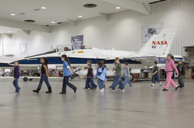 NASA image: Students from the Our Lady of Perpetual Help School in Bakersfield, CA, pass by one of NASA Dryden's F-18 chase aircraft during a tour