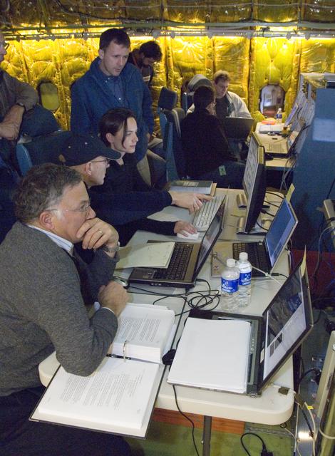 NASA image: Scientists and telescope operators focus on data readouts set up inside NASA's SOFIA airborne observatory during telescope characterization tracking tests