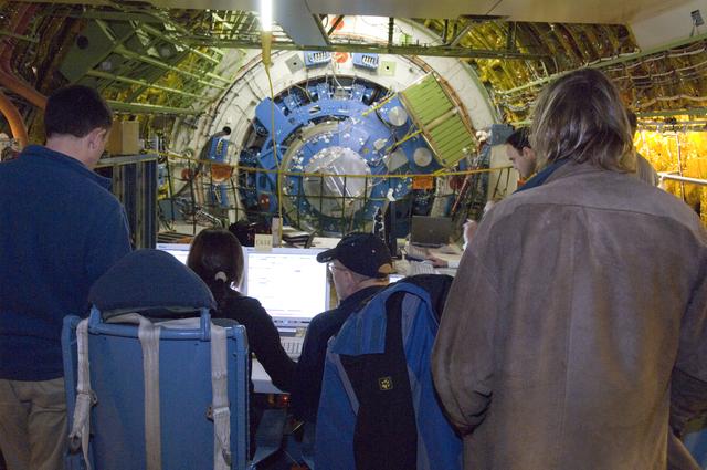 NASA image: As SOFIA's large telescope assembly slowly rotates, scientists and telescope operators review data readouts and imagery on their monitors during tracking tests