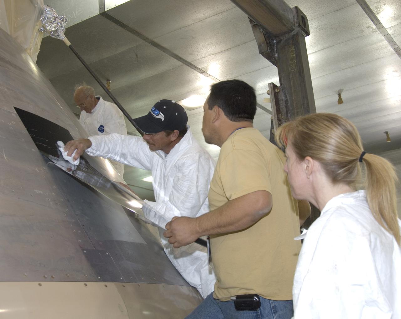 A full-scale flight-test mockup of the Constellation program's Orion crew vehicle arrived at NASA's Dryden Flight Research Center in late March 2008 to undergo preparations for the first short-range flight test of the spacecraft's astronaut escape system later that year. Engineers and technicians at NASA's Langley Research Center fabricated the structure, which precisely represents the size, outer shape and mass characteristics of the Orion space capsule. The Orion crew module mockup was ferried to NASA Dryden on an Air Force C-17. After painting in the Edwards Air Force Base paint hangar, the conical capsule was taken to Dryden for installation of flight computers, instrumentation and other electronics prior to being sent to the U.S. Army's White Sands Missile Range in New Mexico for integration with the escape system and the first abort flight test in late 2008. The tests were designed to ensure a safe, reliable method of escape for astronauts in case of an emergency.