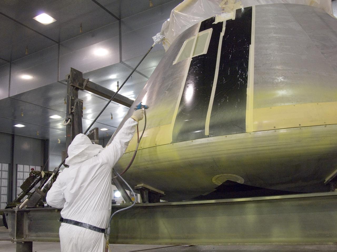 A full-scale flight-test mockup of the Constellation program's Orion crew vehicle arrived at NASA's Dryden Flight Research Center in late March 2008 to undergo preparations for the first short-range flight test of the spacecraft's astronaut escape system later that year. Engineers and technicians at NASA's Langley Research Center fabricated the structure, which precisely represents the size, outer shape and mass characteristics of the Orion space capsule. The Orion crew module mockup was ferried to NASA Dryden on an Air Force C-17. After painting in the Edwards Air Force Base paint hangar, the conical capsule was taken to Dryden for installation of flight computers, instrumentation and other electronics prior to being sent to the U.S. Army's White Sands Missile Range in New Mexico for integration with the escape system and the first abort flight test in late 2008. The tests were designed to ensure a safe, reliable method of escape for astronauts in case of an emergency.