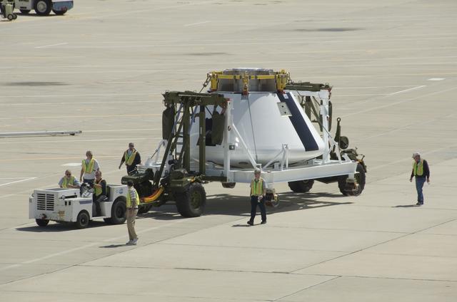 NASA image: NASA Dryden Flight Research Center personnel accompany NASA's first Orion full-scale abort flight test crew module as it heads to its new home.