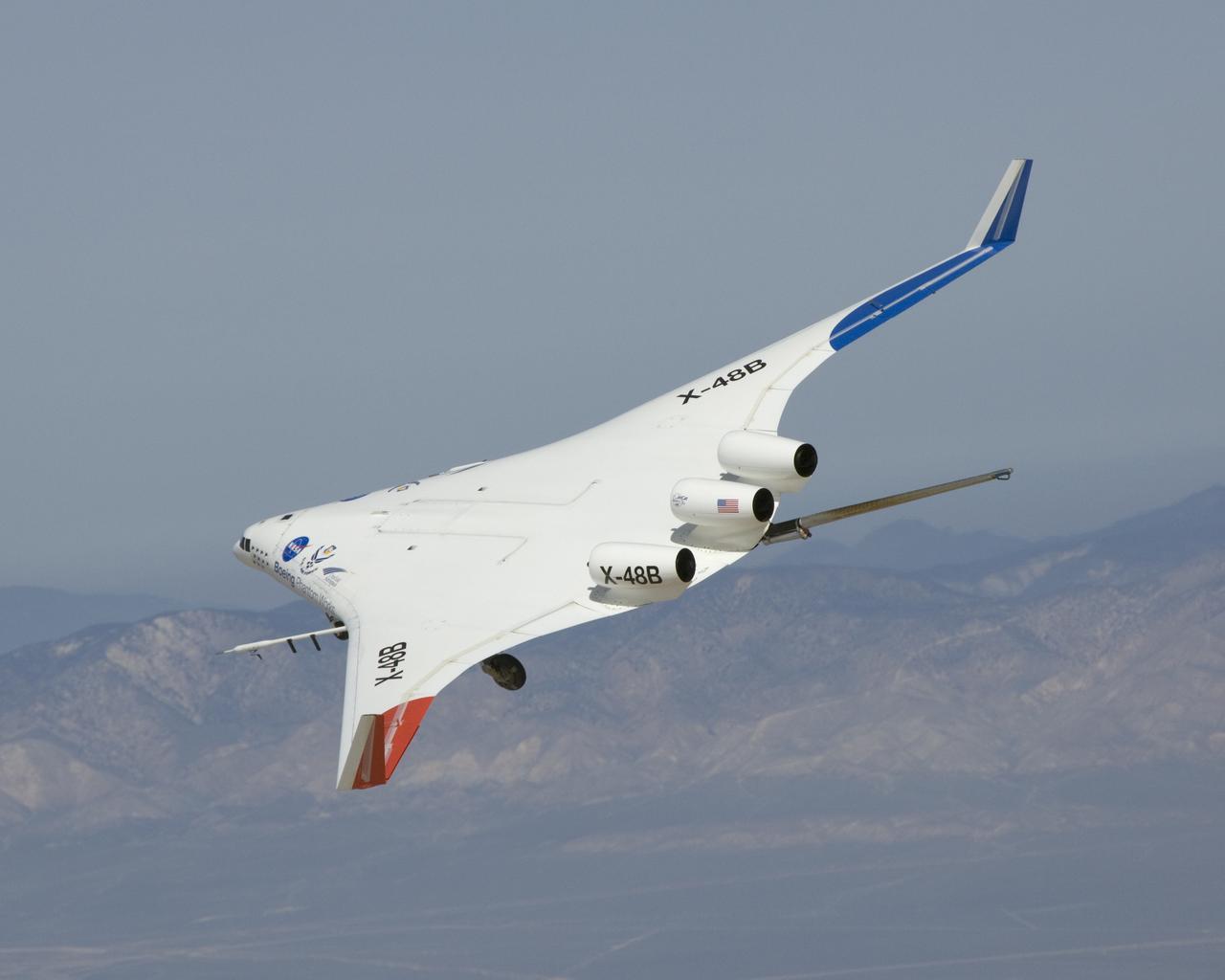 The X-48B Blended Wing Body research aircraft banks smartly in this Block 2 flight phase image.