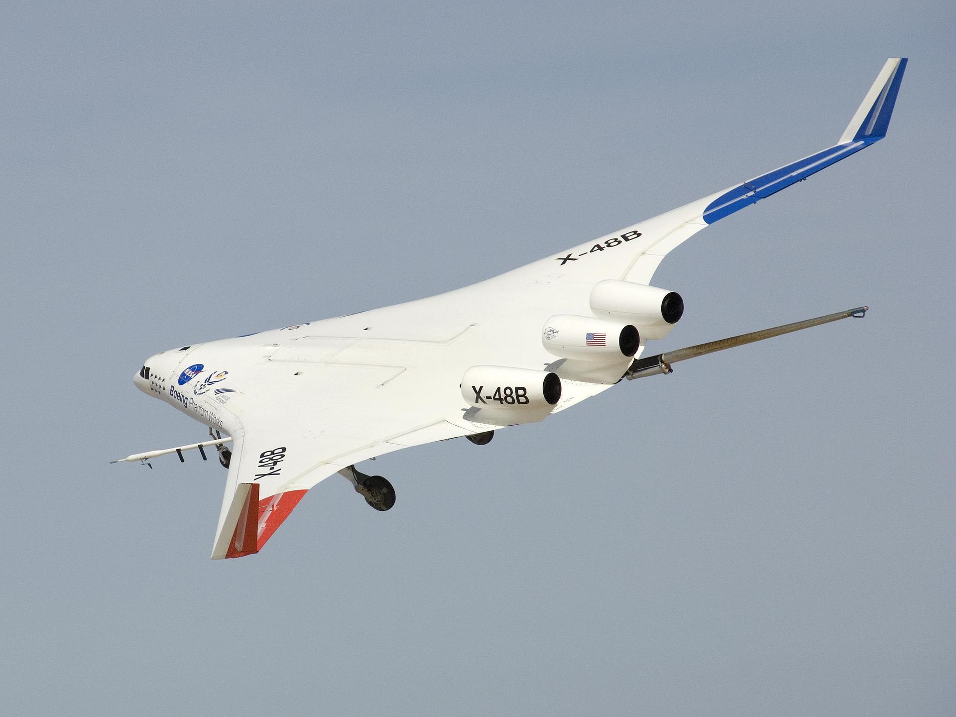 The X-48B Blended Wing Body research aircraft banked smartly in this Block 2 flight phase image.