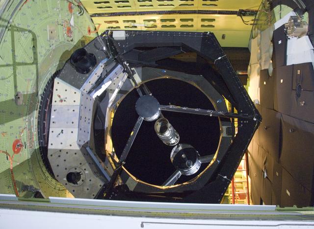 NASA image: The 2.5-meter infrared telescope peers out from its cavity in the SOFIA airborne observatory during nighttime line operations testing at Palmdale, Calif.