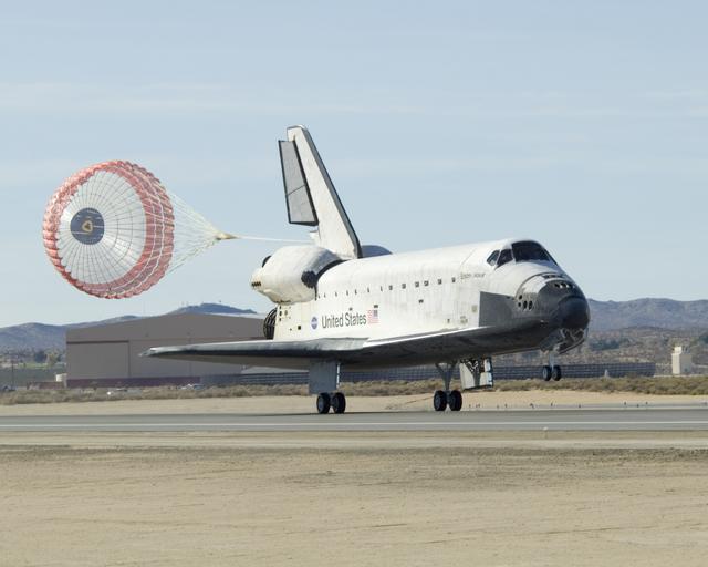 NASA image: Space Shuttle Endeavour's drag chute deploys as it rolls down Runway 04-L at Edwards AFB moments after landing on Nov. 30, 2008