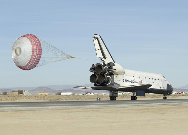 NASA image: Space Shuttle Endeavour's drag chute streams behind as it rolls down on Runway 04-L at Edwards AFB to conclude mission STS-126 on Nov. 30, 2008