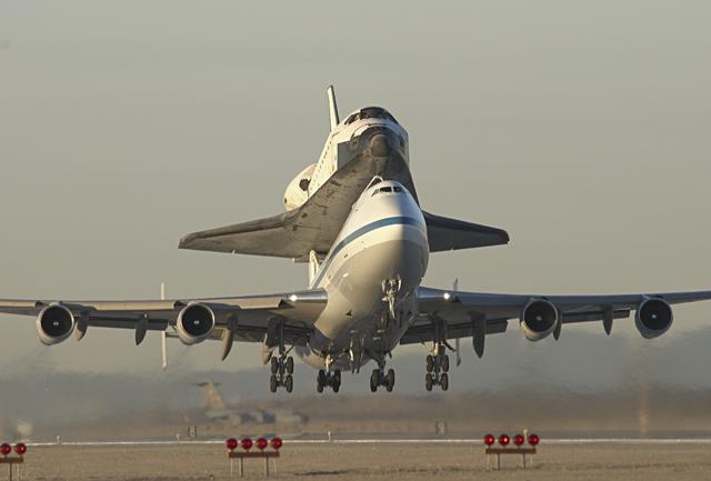 NASA image: Moments after sunrise, the modified 747 carrier aircraft carrying the Endeavour lifts off from Edwards AFB on the first leg of its ferry flight back to KSC